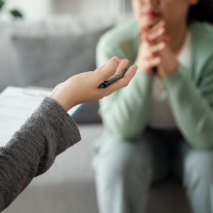 Psychologist doctor examine and listen and talking to patient with depression, anxiety, therapy session, mental health concept